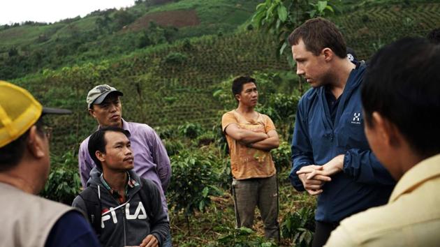 Erlend Falch (R) of UNODC said that because these farmers are from poorest areas of the country they only have access to low-value crops and very limited access to markets and technology. The coffee plantation programme is aimed at establishing a “luxury” arabica coffee brand that can reach wealthy markets from the US to Korea and Japan. (Aidan Jones / AFP)