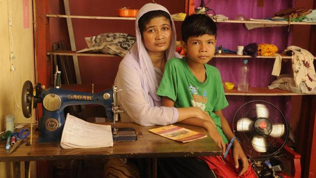 Ruksha Khan, with her son in Kashipur 2 near Silchar. Her husband Hanif Khan committed suicide due to trauma after the family’s names were missing. That Bengalis of both communities find themselves out of the NRC has reinforced their shared identity though that unity is not a given. The Bengali of the Barak valley is not on the same page with those of the Brahmaputra valley. (Samir Jana / HT Photo) Ruksha Khan, with her son in Kashipur 2 near Silchar. Her husband Hanif Khan committed suicide due to trauma after the family’s names were missing. That Bengalis of both communities find themselves out of the NRC has reinforced their shared identity though that unity is not a given. The Bengali of the Barak valley is not on the same page with those of the Brahmaputra valley. (Samir Jana / HT Photo)