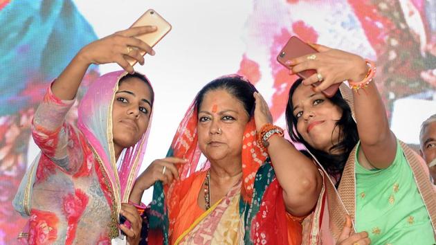 Two women take selfies with Rajasthan chief minister Vasundhara Raje during the 'Rajasthan Gaurav Yatra' at Baytu .(PTI) Two women take selfies with Rajasthan chief minister Vasundhara Raje during the 'Rajasthan Gaurav Yatra' at Baytu .(PTI)