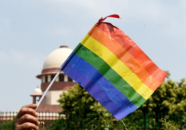A rainbow flag is raised after the verdict by Supreme Court of India stuck down Section 377 of the IPC, outside Supreme Court of India in New Delhi on September 6. (Sushil Kumar/HT PHOTO)