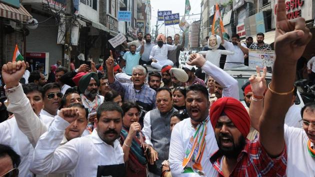 State Congress president Sunil Jakhar along with MP Santokh Chaudhary raising slogans against Prime Minsiter Narendra Modi over steep hike in petrol and diesel prices during a protest rally in Jalandhar on Monday. (Pardeep Pandit/HT) State Congress president Sunil Jakhar along with MP Santokh Chaudhary raising slogans against Prime Minsiter Narendra Modi over steep hike in petrol and diesel prices during a protest rally in Jalandhar on Monday. (Pardeep Pandit/HT)