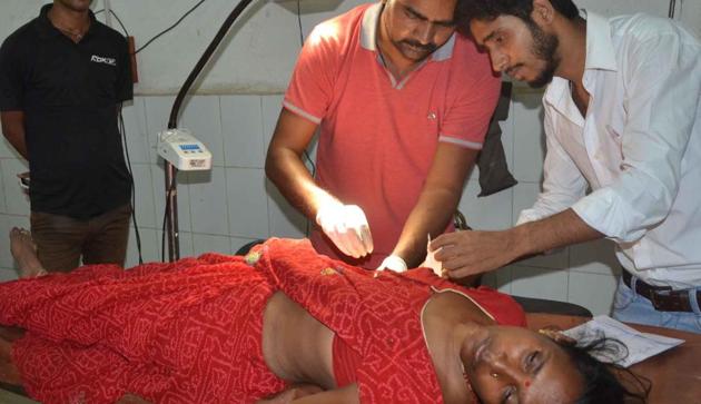 Sabita Devi was injured after being hit by a bullet while sitting outside her house in Dhanbad on Saturday night.(Bijoy / HT Photo)