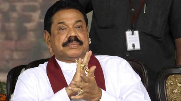 Former Sri Lankan president Mahinda Rajapaksa. The special high court on Monday imposed a travel ban on Gotabhaya Rajapaksa, the younger brother Mahinda Rajapaksa, and six others in a case of corruption. (AP File Photo) Former Sri Lankan president Mahinda Rajapaksa. The special high court on Monday imposed a travel ban on Gotabhaya Rajapaksa, the younger brother Mahinda Rajapaksa, and six others in a case of corruption. (AP File Photo)