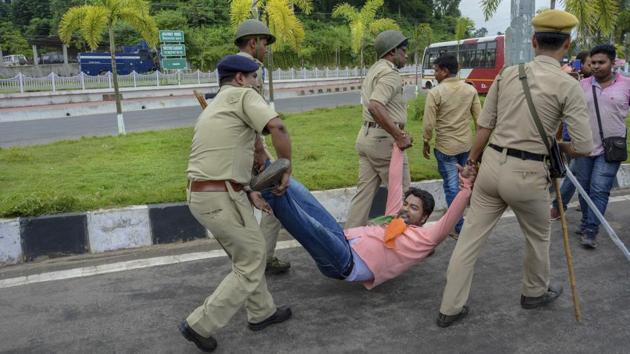 Policemen detain a Congress party worker during a protest in Agartala. The BJP however dubbed the ‘Bharat Bandh’ call as an attempt to spread rumour and confusion among the masses. (PTI) Policemen detain a Congress party worker during a protest in Agartala. The BJP however dubbed the ‘Bharat Bandh’ call as an attempt to spread rumour and confusion among the masses. (PTI)