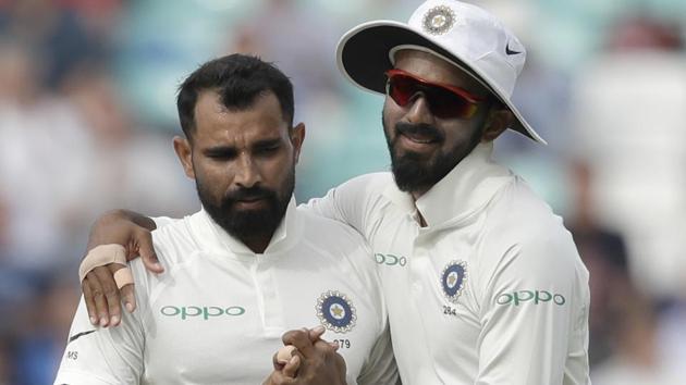 India's Mohammed Shami, left, celebrates taking the wicket of England's Jonny Bairstow. (AP)
