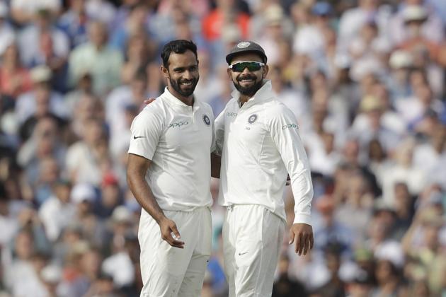 India's Hanuma Vihari, left, celebrates taking the wicket of England's Sam Curran with India captain Virat Kohli. (AP)