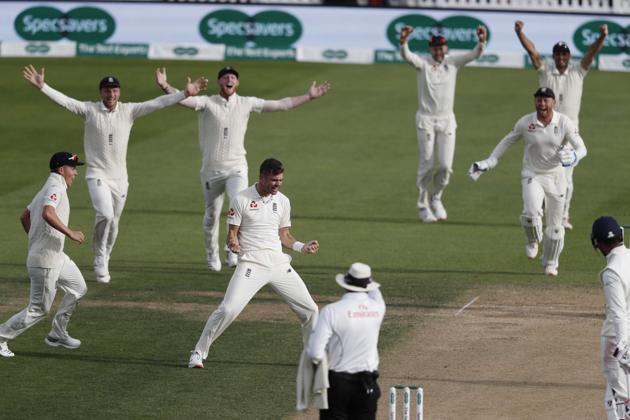 England's James Anderson (C) celebrates taking the wicket of India's Cheteshwar Pujara. (AFP)