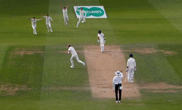 England's Stuart Broad celebrates taking the wicket of India's Virat Kohli. (REUTERS)