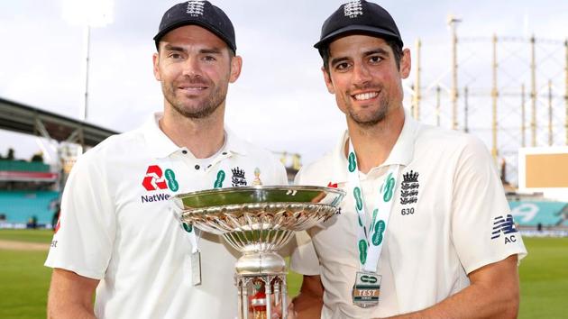 Alastair Cook and James Anderson celebrate with a trophy after the match. (Action Images via Reuters)