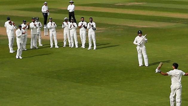 England's Alastair Cook reacts as Jonny Bairstow, India players and fans applaud him as he walks off after losing his wicket. (REUTERS)
