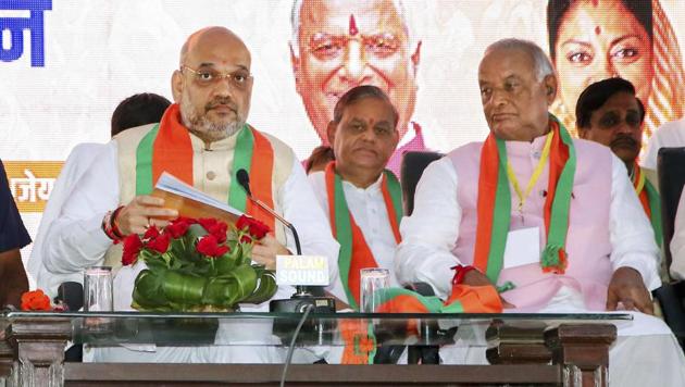 Bharatiya Janata Party president Amit Shah with party's Rajasthan President Madan Lal Saini at the party's 'Shakti Kendra Sammelan', in Jaipur on September 11. (PTI Photo) Bharatiya Janata Party president Amit Shah with party's Rajasthan President Madan Lal Saini at the party's 'Shakti Kendra Sammelan', in Jaipur on September 11. (PTI Photo)