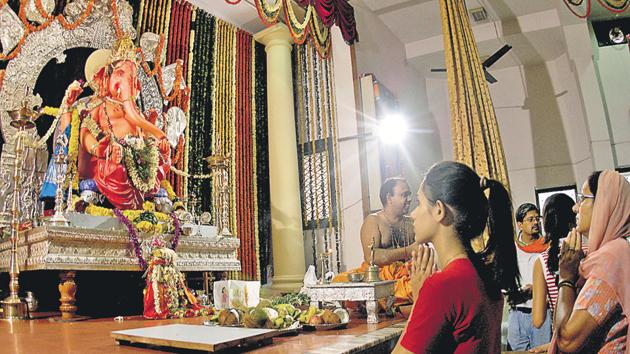 Residents worship at a Ganesh pandal in Delhi’s Rajinder Nagar. (Photo: Virendra Singh) Residents worship at a Ganesh pandal in Delhi’s Rajinder Nagar. (Photo: Virendra Singh)