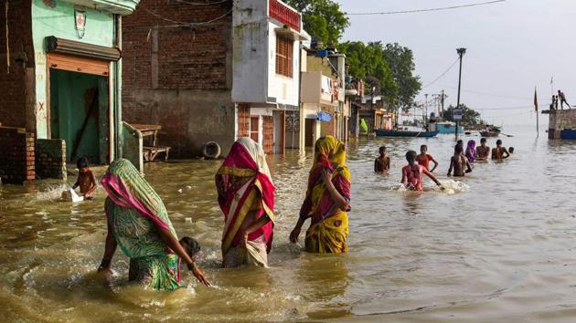 People move to safer places after the water level of river Ganga rose, creating a flood-like situation at Daraganj in Allahabad. A UP government official said earlier the water level of both Ganga and Yamuna was rising due to heavy rainfall in different parts of UP besides the neighbouring state of Madhya Pradesh. (PTI) People move to safer places after the water level of river Ganga rose, creating a flood-like situation at Daraganj in Allahabad. A UP government official said earlier the water level of both Ganga and Yamuna was rising due to heavy rainfall in different parts of UP besides the neighbouring state of Madhya Pradesh. (PTI)