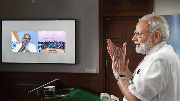 Prime Minister Narendra Modi interacts with the ASHA, Anganwadi and ANM workers from all over the country through video conference in New Delhi on September 11, 2018.(PTI Photo)