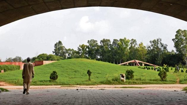 The green and pink garden of conifers in Sector 52 offers some relief to the hard?scrabble existence of most people living in the resettlement colonies here.(SANJEEV SHARMA/HT)