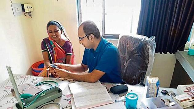 IIPHG-trained community health officer Abid Mansuri, 32, at the Health and Wellness Centre in Raslod village in Gujarat’s Sabarkantha district.(HT Photo)