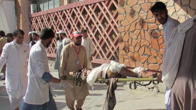 Afghan men carry an injured man to a hospital after a suicide attack in Nangarhar province, Afghanistan September 11, 2018. (REUTERS) Afghan men carry an injured man to a hospital after a suicide attack in Nangarhar province, Afghanistan September 11, 2018. (REUTERS)