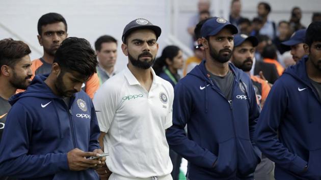 India captain Virat Kohli, center left, waits with his teammates for the trophy presentations to start after England won the fifth cricket test match and the five match series between England and India at the Oval cricket ground(AP)