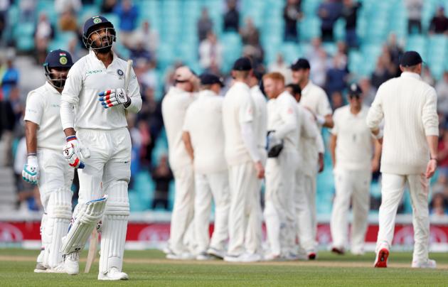 India's K. L. Rahul (2L) walks back to the pavilion after losing his wicket for 149. (AFP) India's K. L. Rahul (2L) walks back to the pavilion after losing his wicket for 149. (AFP)