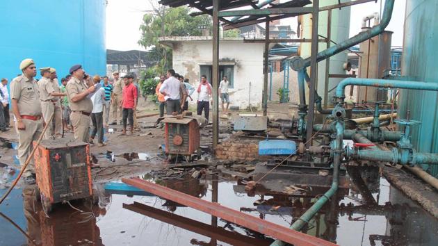 People stand near the site of explosion at a petro-chemical factory where a methane gas boiler tank exploded killing six workers, in Bijnor on September 12.(HT Photo) People stand near the site of explosion at a petro-chemical factory where a methane gas boiler tank exploded killing six workers, in Bijnor on September 12.(HT Photo)