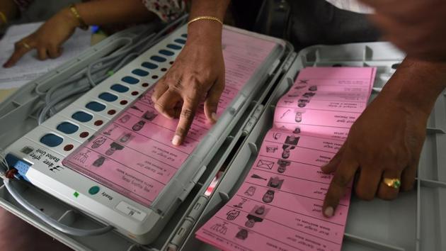 A polling staff tallies the candidates’ names on the EVM in Bengaluru on May 11. (Arijit Sen/HT File Photo) A polling staff tallies the candidates’ names on the EVM in Bengaluru on May 11. (Arijit Sen/HT File Photo)