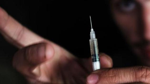 Senjarul Sheikh had taken a consignment of heroin and was supposed to pay ₹4.5 lakh for the drug, but could not pay up. (AFP File Photo/Representative image) Senjarul Sheikh had taken a consignment of heroin and was supposed to pay ₹4.5 lakh for the drug, but could not pay up. (AFP File Photo/Representative image)