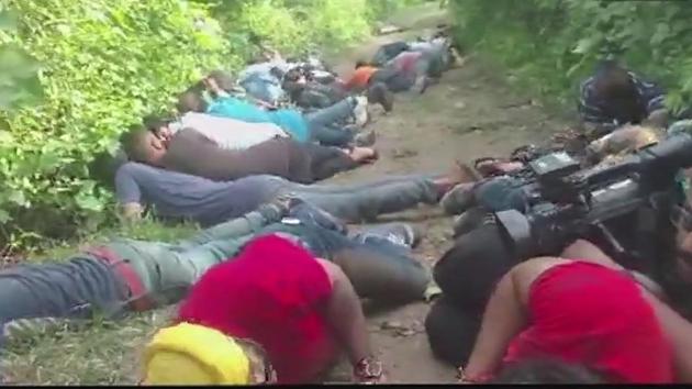 People, including journalists, take cover during an encounter between security forces and terrorists in Jammu’s Kakriyal. (ANI) People, including journalists, take cover during an encounter between security forces and terrorists in Jammu’s Kakriyal. (ANI)