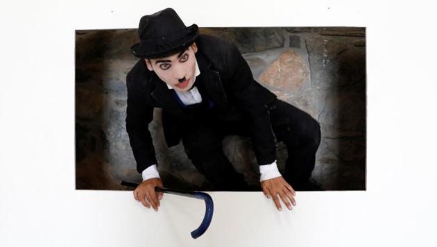 Karim Asir, a Charlie Chaplin impersonator, exercises during his rehearsals in Kabul. Afghanistan’s Chaplin says he has witnessed suicide attacks, explosions and threats from hardline Islamic militant groups, but is determined to waddle and bumble to fulfil the primary goal of his life. (Mohammad Ismail / REUTERS) Karim Asir, a Charlie Chaplin impersonator, exercises during his rehearsals in Kabul. Afghanistan’s Chaplin says he has witnessed suicide attacks, explosions and threats from hardline Islamic militant groups, but is determined to waddle and bumble to fulfil the primary goal of his life. (Mohammad Ismail / REUTERS)