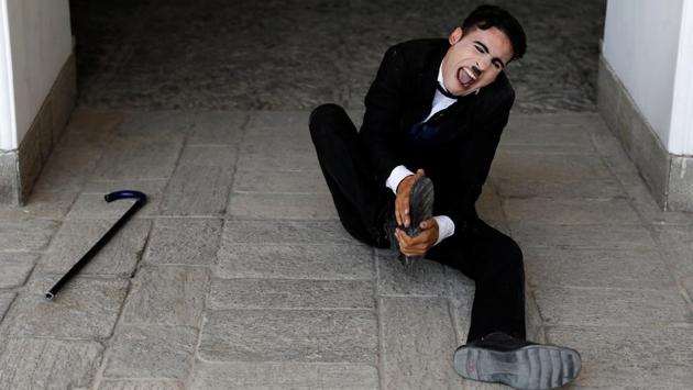 Asir reacts during his rehearsals. The 25-year-old said Chaplin impersonators are found all over the world helping people ignore grief and making them laugh, and he does the same. (Mohammad Ismail / REUTERS) Asir reacts during his rehearsals. The 25-year-old said Chaplin impersonators are found all over the world helping people ignore grief and making them laugh, and he does the same. (Mohammad Ismail / REUTERS)