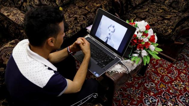 Karim Asir watches a Charlie Chaplin movie in Parwan province. Asir says he has been threatened by militants who say his performances are un-Islamic. But despite the threats, he performs in public parks, orphanages, private parties and at charity events organised by international aid agencies. (Mohammad Ismail / REUTERS) Karim Asir watches a Charlie Chaplin movie in Parwan province. Asir says he has been threatened by militants who say his performances are un-Islamic. But despite the threats, he performs in public parks, orphanages, private parties and at charity events organised by international aid agencies. (Mohammad Ismail / REUTERS)