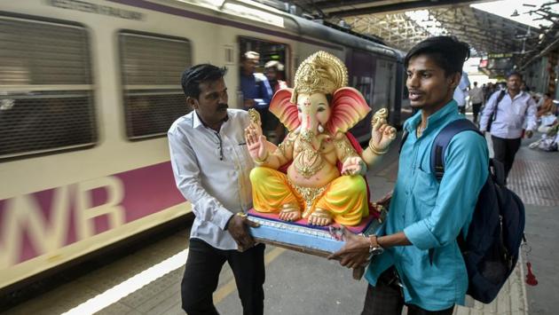 Devotees carry an idol of the Hindu god Ganesha from a workshop to a place of worship at Dadar in Mumbai. Devotees of Ganesha look forward all year to Ganesh Chaturthi or Ganeshotsav, a 10-day festival during which Ganesha idols are brought home or to public pandals and followed by ten days of festivities. (Kunal Patil / HT Photo) Devotees carry an idol of the Hindu god Ganesha from a workshop to a place of worship at Dadar in Mumbai. Devotees of Ganesha look forward all year to Ganesh Chaturthi or Ganeshotsav, a 10-day festival during which Ganesha idols are brought home or to public pandals and followed by ten days of festivities. (Kunal Patil / HT Photo)