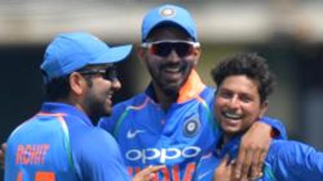 India's Kuldeep Yadav (R) celebrates, with teammates, the wicket of England's Jason Roy for 40 during the second One Day International (ODI) cricket match between England and India, at Lord's Cricket Ground in London on July 14, 2018. / AFP PHOTO / OLLY GREENWOOD / RESTRICTED TO EDITORIAL USE. NO ASSOCIATION WITH DIRECT COMPETITOR OF SPONSOR, PARTNER, OR SUPPLIER OF THE ECB (AFP) India's Kuldeep Yadav (R) celebrates, with teammates, the wicket of England's Jason Roy for 40 during the second One Day International (ODI) cricket match between England and India, at Lord's Cricket Ground in London on July 14, 2018. / AFP PHOTO / OLLY GREENWOOD / RESTRICTED TO EDITORIAL USE. NO ASSOCIATION WITH DIRECT COMPETITOR OF SPONSOR, PARTNER, OR SUPPLIER OF THE ECB (AFP)