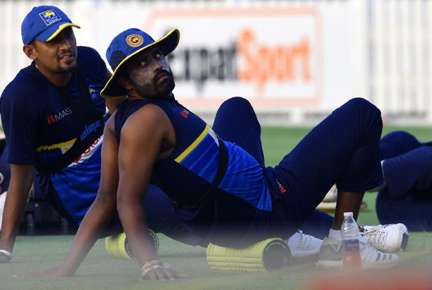 Sri Lankan cricketers Thisara Perera (R) and Suranga Lakmal (L) warms up during a training session at the Dubai Sports city in Dubai. (AFP) Sri Lankan cricketers Thisara Perera (R) and Suranga Lakmal (L) warms up during a training session at the Dubai Sports city in Dubai. (AFP)