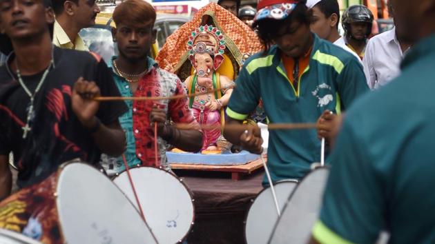 Devotees play drums as they transport an idol of the elephant-headed Hindu deity Ganesh for the Ganesh Chaturthi festival in Mumbai. The ten day festival which began on Thursday will come to a close with the immersion of idols on September 23. (Punit Paranjpe / AFP) Devotees play drums as they transport an idol of the elephant-headed Hindu deity Ganesh for the Ganesh Chaturthi festival in Mumbai. The ten day festival which began on Thursday will come to a close with the immersion of idols on September 23. (Punit Paranjpe / AFP)