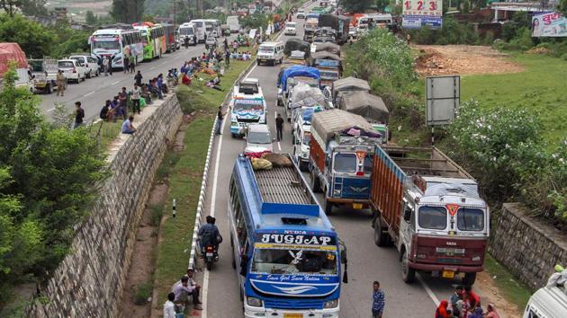 Stranded vehicles seen on Srinagar-Jammu National highway during a search operation carried out by army personnel on the second day following a militant attack at a CRPF party, at Jahjar Kotli. One of the three militants who had fired was killed on Thursday, police said. (PTI) Stranded vehicles seen on Srinagar-Jammu National highway during a search operation carried out by army personnel on the second day following a militant attack at a CRPF party, at Jahjar Kotli. One of the three militants who had fired was killed on Thursday, police said. (PTI)