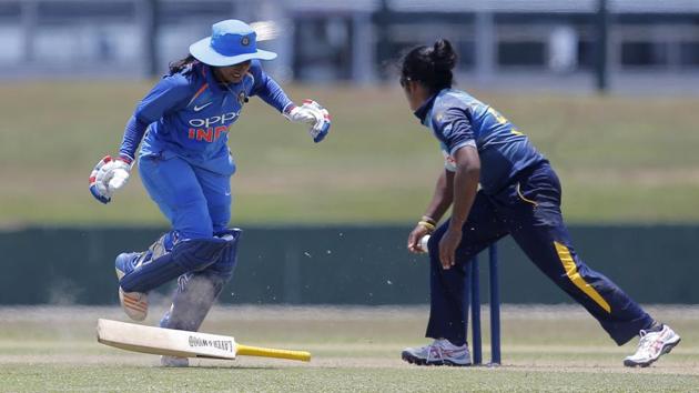 Mithali Raj drops her bat while completing a run as Sri Lanka’s Chamari Atapattu attempts to break the wicket during their second women’s one day international cricket match in Galle, Sri Lanka. Chasing a target of 220, Sri Lanka need 81 runs in 75 balls to level the series. (Eranga Jayawardena / AP) Mithali Raj drops her bat while completing a run as Sri Lanka’s Chamari Atapattu attempts to break the wicket during their second women’s one day international cricket match in Galle, Sri Lanka. Chasing a target of 220, Sri Lanka need 81 runs in 75 balls to level the series. (Eranga Jayawardena / AP)