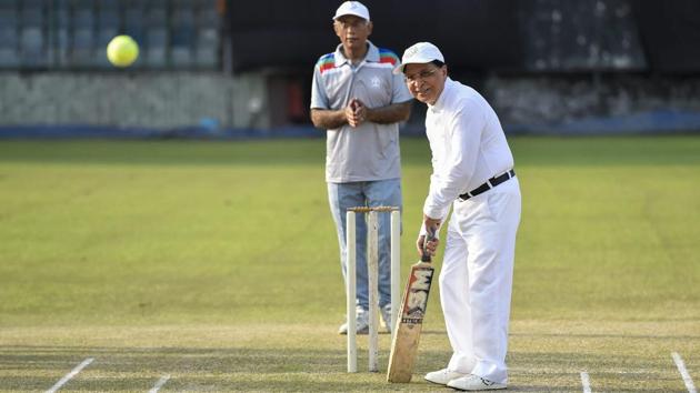 Chief Justice Dipak Misra plays a shot during an annual cricket match between Chief Justice of India-XI and Supreme Court Bar Association-XI in New Delhi on September 12, 2018. (Ravi Choudhary / PTI) 