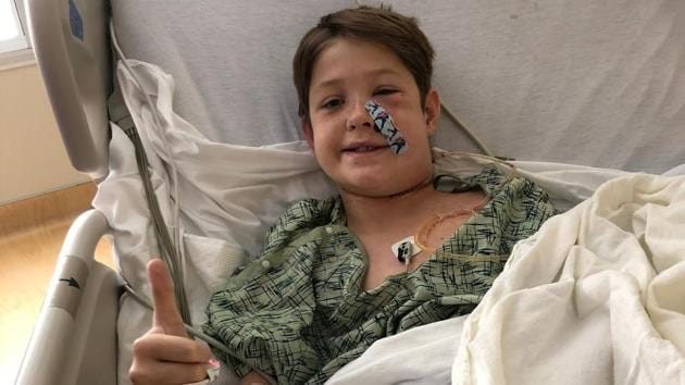 This image courtesy of Shannon Miller, shows Miller's stepson, Xavier Cunningham, 10, recovering at a hospital after surgery in Kansas City, Missouri. (AFP/Shannon Miller) This image courtesy of Shannon Miller, shows Miller's stepson, Xavier Cunningham, 10, recovering at a hospital after surgery in Kansas City, Missouri. (AFP/Shannon Miller)