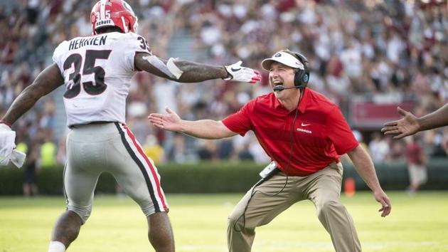 Georgia head coach Kirby Smart celebrates with Brian Herrien (35) after Herrien’s touchdown during the second half of an NCAA college football game against South Carolina, in Columbia. (Sean Rayford / AP)
