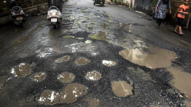 Government statistics show that potholes were responsible for the deaths of 3,597 people across India last year, an average of 10 a day. Citizens blame government apathy, accusing local authorities of failing to maintain roads properly while activists said contractors hired to repave roads do a bad job on purpose so the work will need to be done again the following year. (Satish Bate / HT File)