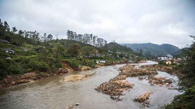 Debris from a landslide sits in a river that runs near tea estates near Munnar in Idukki district of August 25. (Bloomberg) Debris from a landslide sits in a river that runs near tea estates near Munnar in Idukki district of August 25. (Bloomberg)