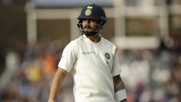 India captain Virat Kohli walks off the field of play after losing his wicket.(AP)