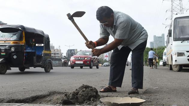 To help deal with his grief, Prakash’s devastated father Dadarao Bilhore decided he would do something about Mumbai’s roads, which like much of India’s, are notoriously shoddy. (AFP) To help deal with his grief, Prakash’s devastated father Dadarao Bilhore decided he would do something about Mumbai’s roads, which like much of India’s, are notoriously shoddy. (AFP)