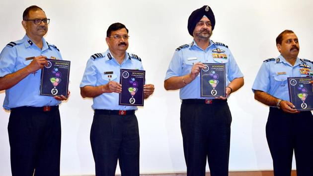 Air Chief Marshal BS Dhanoa (2nd from R), releases a souvenir during the inauguration of 57th Annual Conference of Indian Society of Aerospace Medicine in Bengaluru on Sep 14, 2018.(PTI)