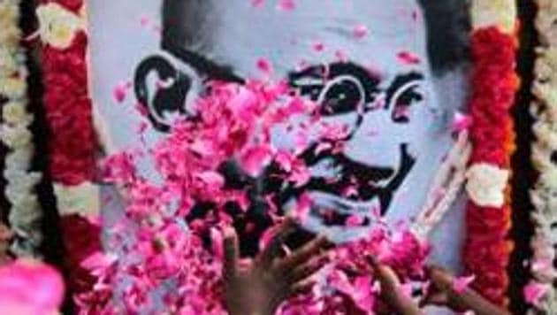 School children pay homage to a portrait of Mahatma Gandhi, in Chennai. (PTI File Photo) School children pay homage to a portrait of Mahatma Gandhi, in Chennai. (PTI File Photo)