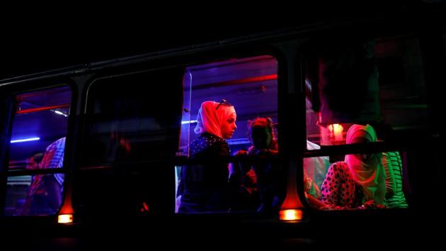 People travel in a bus in Damascus, Syria. (Marko Djurica / REUTERS)
