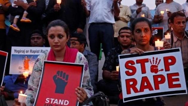 People participate in a candle light vigil as they protest against the rape of an eight-year-old girl in Kathua near Jammu, and a teenager in Unnao, Uttar Pradesh state, in Bengaluru, India, April 13, 2018. REUTERS/Abhishek N. Chinnappa