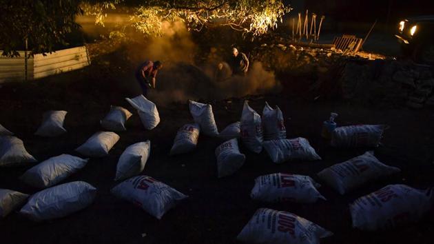 Perhaps that’s why the most famous charcoal maker in the Basque-speaking valleys is Olentzero, the Father Christmas-like, wine-loving mythical figure who drops off presents to well-behaved children — and leaves charcoal for the roguish — as he goes down the mountains at the height of winter. (Alvaro Barrientos / AP) Perhaps that’s why the most famous charcoal maker in the Basque-speaking valleys is Olentzero, the Father Christmas-like, wine-loving mythical figure who drops off presents to well-behaved children — and leaves charcoal for the roguish — as he goes down the mountains at the height of winter. (Alvaro Barrientos / AP)