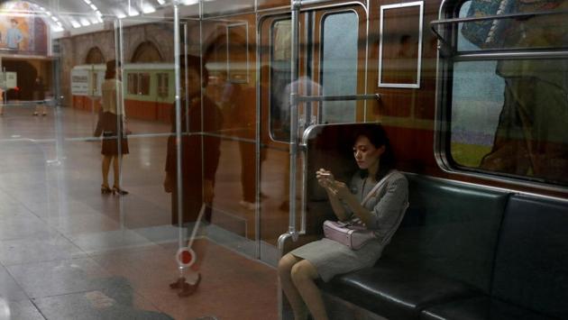 A woman sits in a train at a subway station in Pyongyang, North Korea. (Danish Siddiqui / REUTERS)