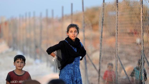 Newly displaced Syrian children arrive to a refugee camp in Atimah village, Idlib province, Syria. (Khalil Ashawi / REUTERS)